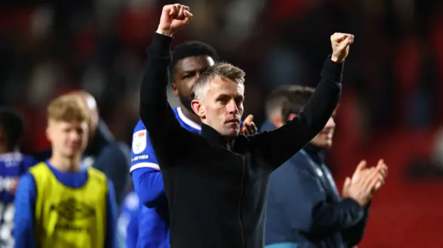 Ipswich boss Kieran McKenna celebrating their win at Charlton with raised arms
