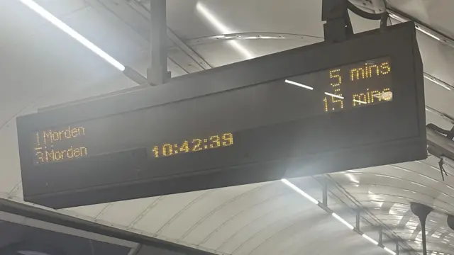 Sign at station showing destination of Tubes