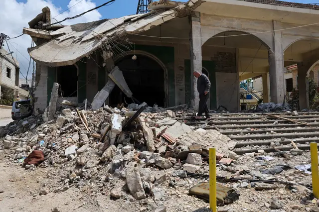 A man inspects the damage at a mosque that was targeted in an Israeli strike in the southern Lebanese village of Kfar Sir on April 21, 2026