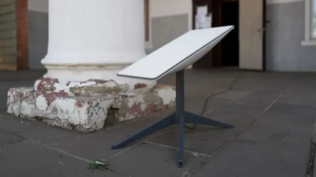 A Starlink dish establishes a satellite connection to provide internet to a humanitarian center on September 24, 2024