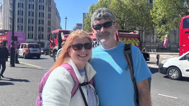 Anne and Richard pose for a photo in central London