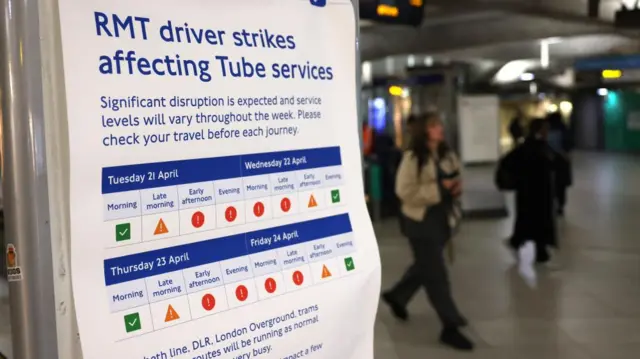 A poster at a Tube station shows a sign explaining that the RMT Tube drivers are striking. It shows that the strikes will cause disruption on Thursday from early afternoon into the late morning on Friday