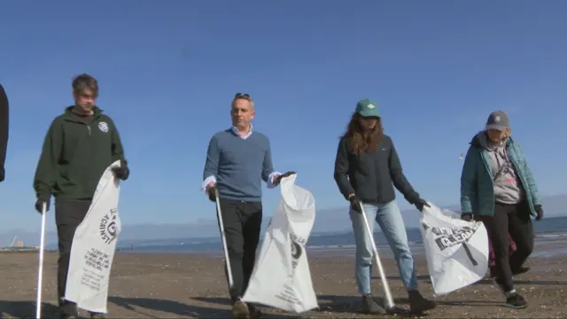 Scottish Lib Dem leader Alex Cole-Hamilton picks up litter with colleagues on Portobello Beach