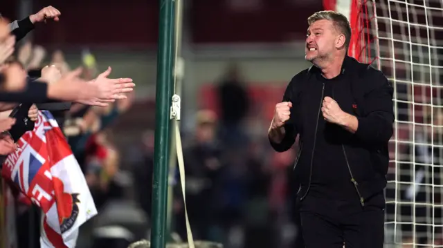 Karl Robinson celebrates