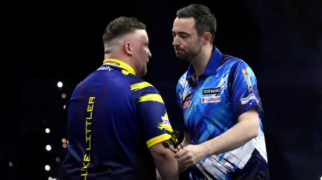 Luke Humphries and Luke Littler shake hands