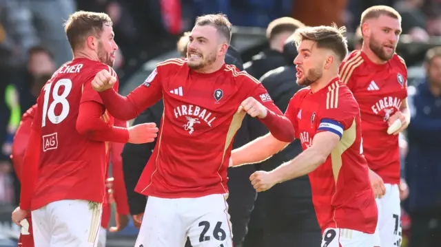 Ryan Graydon celebrates a goal to make it 1-0 against Notts County with his Salford team-mates