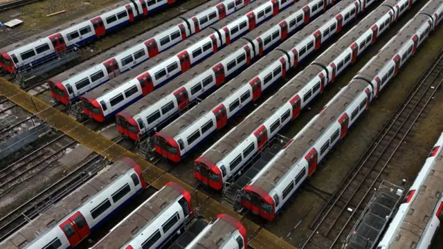 A row of Tube trains are seen in a depot at the Cockfosters Depot on Tuesday
