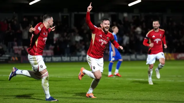 Ollie Turton celebrates
