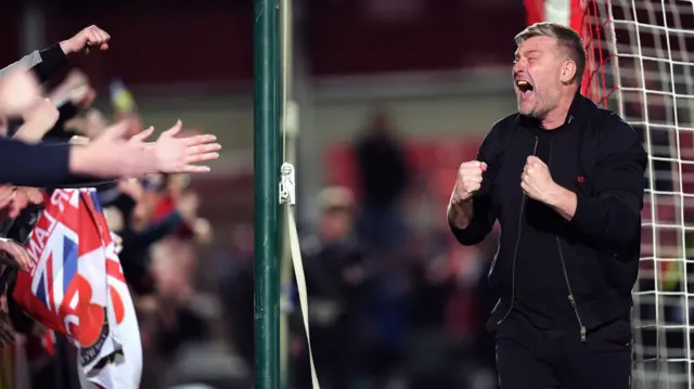 Karl Robinson celebrates