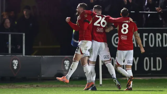 Ollie Turton celebrates