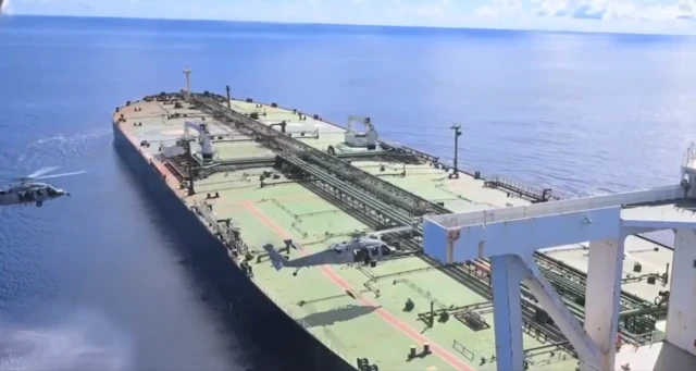 A video still shows US helicopters landing on a ship.