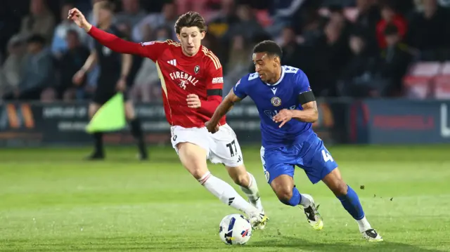 Josh Austerfield of Salford City and Ashley Charles of Bromley