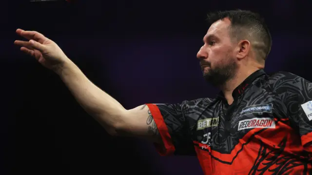 Jonny Clayton throws a dart