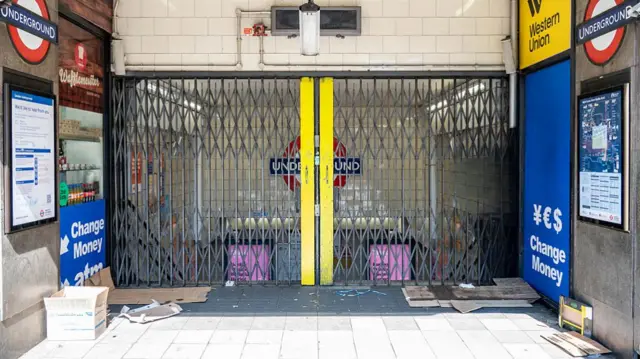 A London Underground Tube station, with the entrance closed off as it is shut