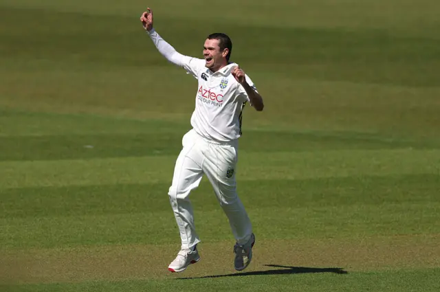 Sam Conners celebrates taking a wicket for Durham.