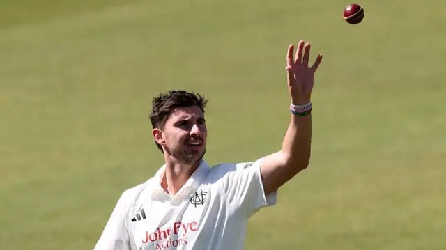 Nottinghamshire bowler Josh Tongue catches the ball