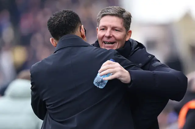 Liam Rosenior (L) embraces Crystal Palace's Austrian manager Oliver Glasner