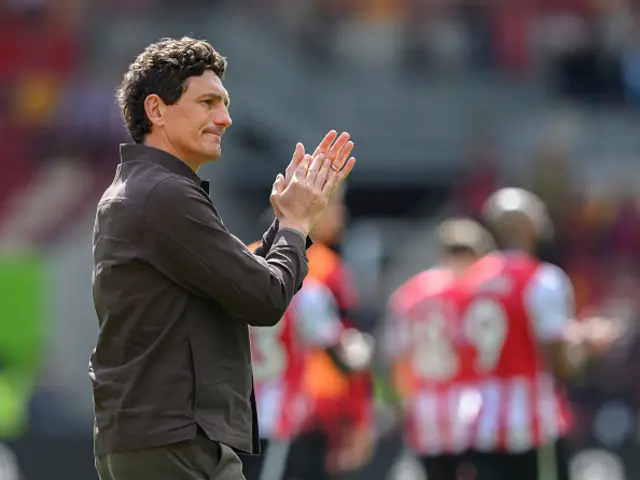 Brentford manager Keith Andrews applauds the fans at the final whistle