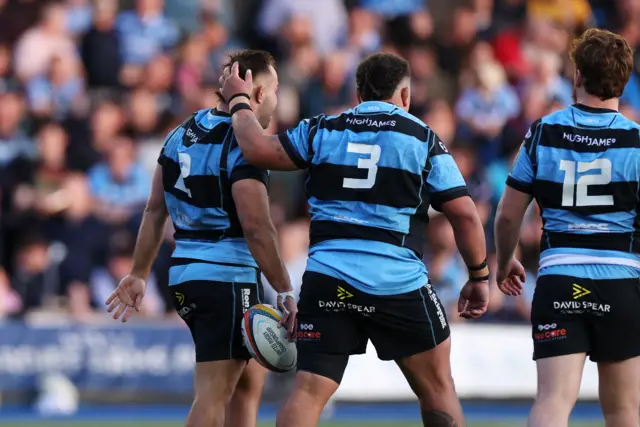 Liam Belcher is congratulated after his try