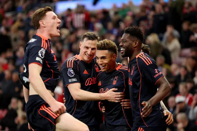 Forest players celebrate wildly after their fourth goal