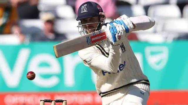Ed Barnard of Warwickshire hits the ball while batting