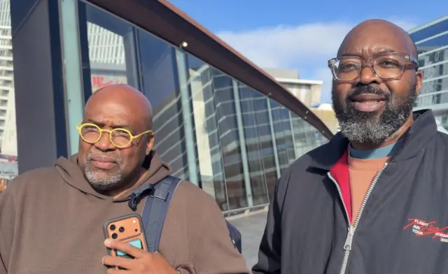 Elliot and Bolaji standing outside Stratford station