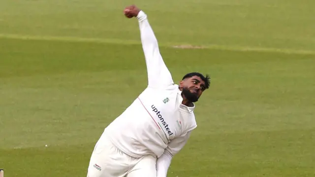 Leicestershire leg spinner Rehan Ahmed in his bowling action.