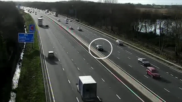 The Nissan Micra circled in white as other vehicles pass on either side of the motorway.