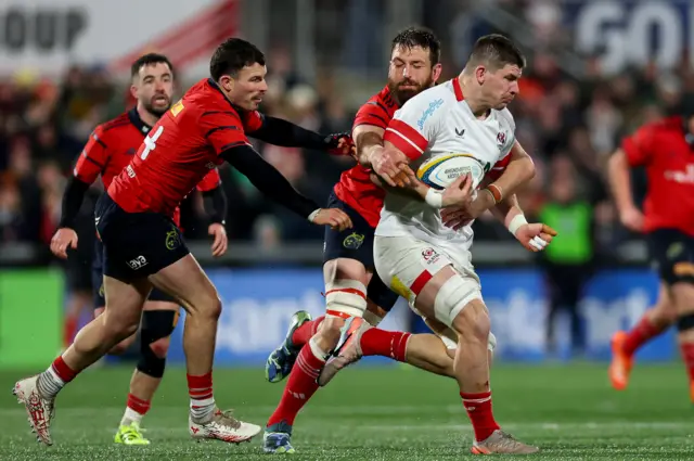 Munster's Calvin Nash and Jean Kleyn tackle Ulster's Nick Timoney