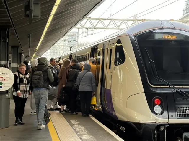 People boarding Elizabeth line train at Stratford