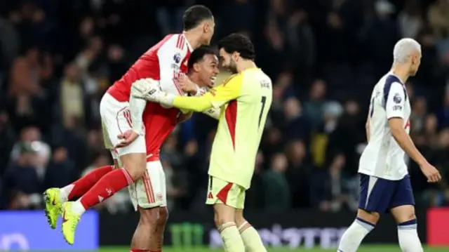 William Saliba, Gabriel and David Raya of Arsenal celebrate