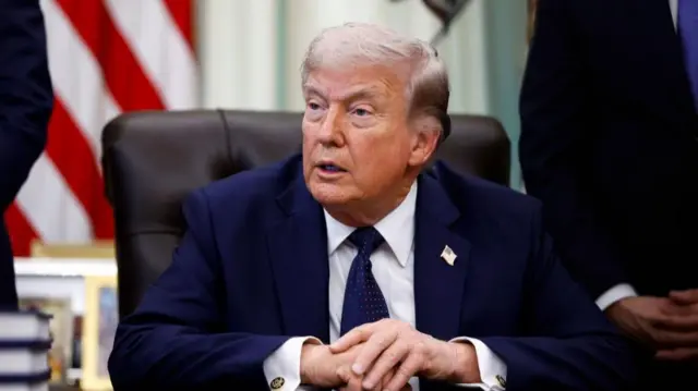 President Trump sat behind a desk
