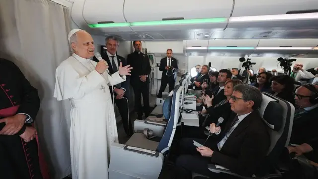 Pope Leo XIV speaks to journalists aboard the papal flight from Malabo to Rome, on April 23, 2026