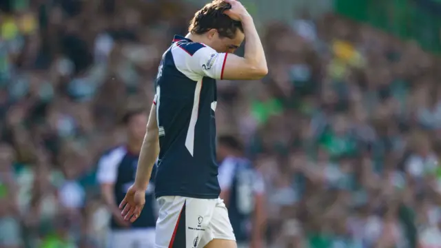 Falkirk's Keelan Adams looks dejected after Daizen Maeda pounced to make it 1-0
