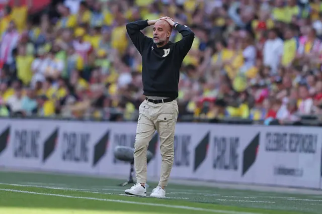 Pep Guardiola, head coach of Manchester City, reacts