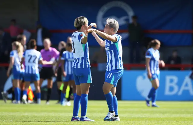 Brighton players celebrate at full time