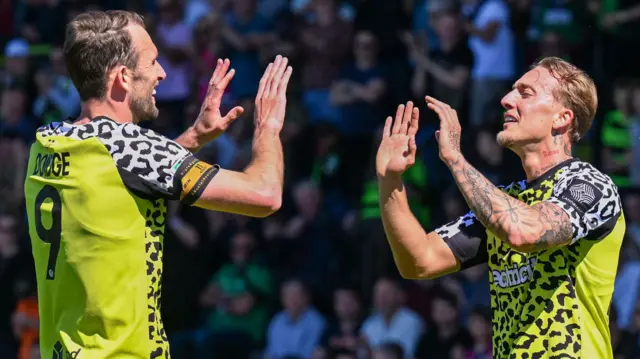 Forest Green Rovers forward Ricardo Rees (right) celebrates