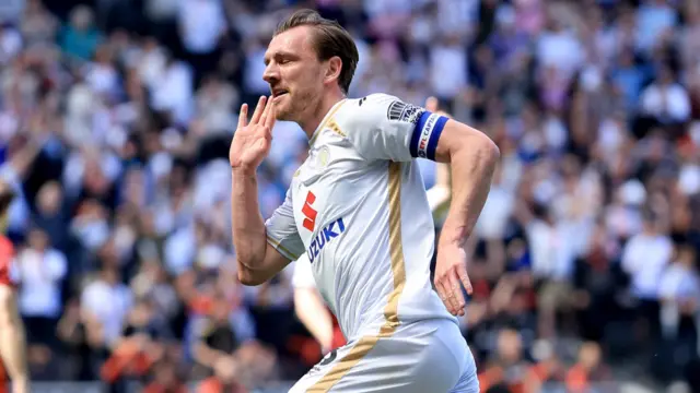Alex Gilbey celebrates after doubling the lead for MK Dons