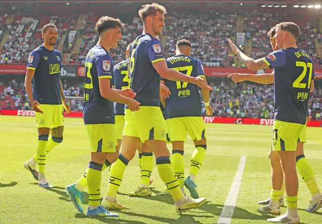 Preston players celebrate one of Liam Lindsay's goals at Sheffield United