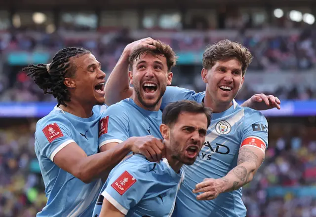 Nico Gonzalez of Manchester City celebrates scoring his team's second goal with teammates Nathan Ake, Bernardo Silva and John Stones