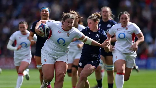 Sarah Bern hands-off a Scotland player