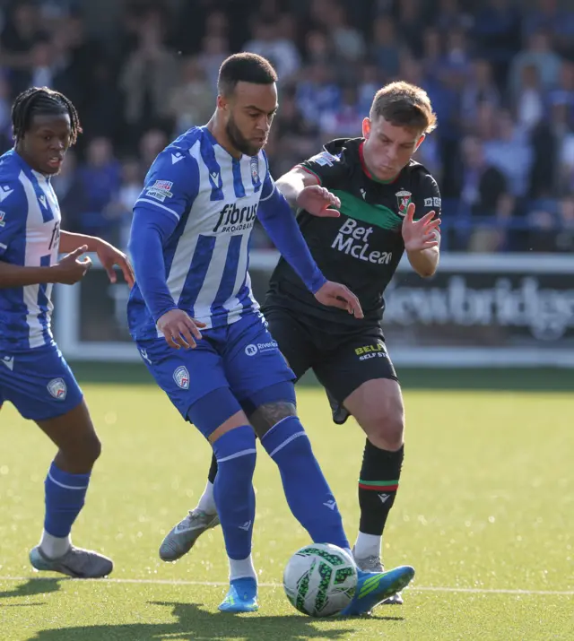 Charles Dunne shields the ball