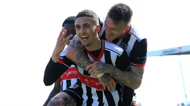 Jaze Kabia and Grimsby teammates celebrate