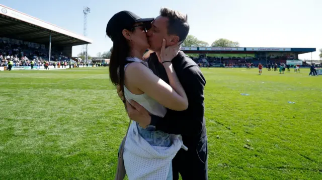 York boss Stuart Maynard kisses his partner on the pitch