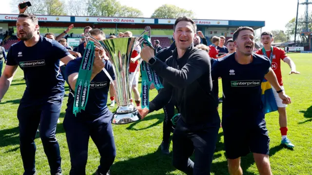 York City boss Stuart Maynard celebrates with the National League trophy