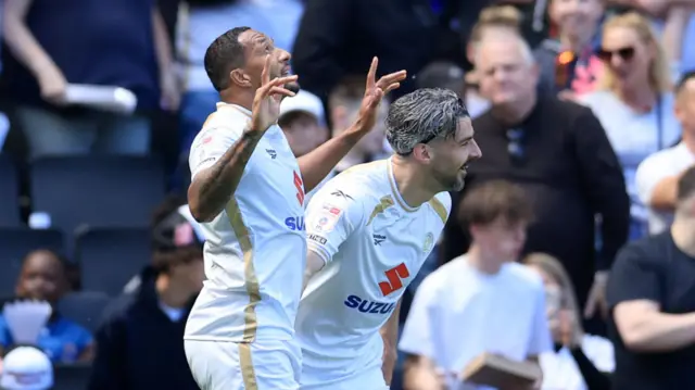 Nathaniel Mendez-Laing of Milton Keynes Dons celebrates scoring their side's first goal of the game