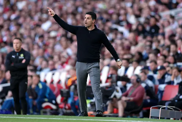 Mikel Arteta, Manager of Arsenal, points on the sidelines