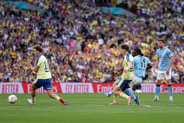 Jeremy Doku of Manchester City scores