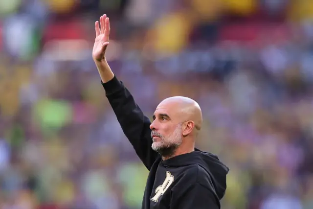 Pep Guardiola Manager / Head Coach of Manchester City waves