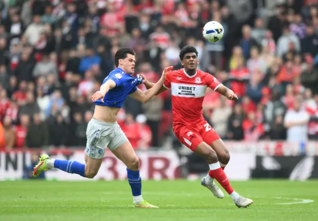 Adilson Malanda of Middlesbrough fends off Luca Kjerrumgaard of Watford